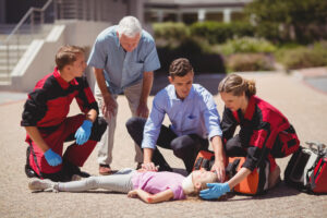 Emergency responders evaluating a victim to determine when to start CPR