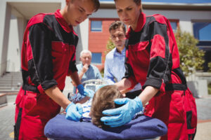 Medical professionals using ileria CPR feedback device during resuscitation
