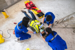 first aid head injuries considered all trauma incidents worker work first aid training transfer patient loss feeling loss normal movement - Ileria CPR Feedback training technology