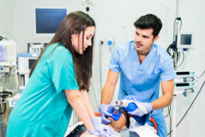 medics making emergency procedure with respirator - Ileria CPR Feedback training technology